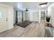 Bright entry with new flooring, a modern light fixture, and ample closet space at 4931 Tropicana Dr, Indian Lake Estates, FL 33855