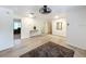 Bright, modern living space with updated floors and fixtures and a contemporary ceiling fan at 4931 Tropicana Dr, Indian Lake Estates, FL 33855