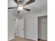 Bedroom with a ceiling fan and closet, providing plenty of storage space at 700 Crestwood Way, Winter Springs, FL 32708