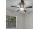 Bedroom with ceiling fan and large window, offering a relaxing space at 700 Crestwood Way, Winter Springs, FL 32708