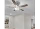 Ceiling fan with wood blades and globe light centered in a neutral-toned living space at 700 Crestwood Way, Winter Springs, FL 32708