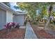 Inviting single-story home exterior with a well-manicured lawn and walkway leading to the front door at 700 Crestwood Way, Winter Springs, FL 32708