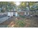 Beautiful single-story home with mature landscaping, a lush lawn, a brick accent, and a welcoming entrance at 700 Crestwood Way, Winter Springs, FL 32708