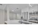 Bright kitchen featuring stainless steel appliances, white cabinets, stone countertops, and an open layout at 700 Crestwood Way, Winter Springs, FL 32708