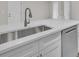 Kitchen featuring stainless steel appliances, white cabinets, stone countertops, and a stainless steel sink at 700 Crestwood Way, Winter Springs, FL 32708