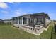 Expansive backyard with lush landscaping and a built-in grill area, perfect for outdoor enjoyment at 8534 Sw 59Th Lane Rd, Ocala, FL 34481
