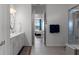 Bright bathroom featuring dual sinks, stylish mirror, and glass shower with a view into the main bedroom at 8534 Sw 59Th Lane Rd, Ocala, FL 34481