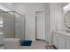 Bathroom features a glass shower enclosure, double sinks, and neutral tile at 8534 Sw 59Th Lane Rd, Ocala, FL 34481