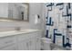 Bright bathroom with a white vanity, and a shower with a patterned shower curtain at 8534 Sw 59Th Lane Rd, Ocala, FL 34481