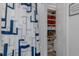 Shower area with stylish curtain and access to closet with organized shelving at 8534 Sw 59Th Lane Rd, Ocala, FL 34481