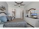 Comfortable bedroom with a ceiling fan, natural light, and neutral paint colors at 8534 Sw 59Th Lane Rd, Ocala, FL 34481