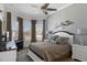 Comfortable bedroom featuring natural light from the windows and a ceiling fan at 8534 Sw 59Th Lane Rd, Ocala, FL 34481