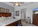 Spacious bedroom with hardwood floors, decorative furniture, and a ceiling fan at 8534 Sw 59Th Lane Rd, Ocala, FL 34481