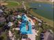 Resort-style community pool featuring lush landscaping, lounge areas, and a splash pad at 8534 Sw 59Th Lane Rd, Ocala, FL 34481