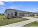Charming home with stone accents, well-kept lawn, and a two-car garage in a residential neighborhood at 8534 Sw 59Th Lane Rd, Ocala, FL 34481