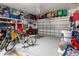 Spacious two-car garage with high ceilings, overhead storage racks, and speckled epoxy flooring at 8534 Sw 59Th Lane Rd, Ocala, FL 34481