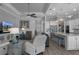 Open-concept living space blends a living room, kitchen with island seating and a view of the front hallway at 8534 Sw 59Th Lane Rd, Ocala, FL 34481