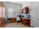 Home office featuring custom built-ins, a desk area, and lots of natural light at 8534 Sw 59Th Lane Rd, Ocala, FL 34481