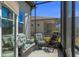 Inviting screened patio with wicker furniture, perfect for enjoying the outdoors in comfort and style at 8534 Sw 59Th Lane Rd, Ocala, FL 34481