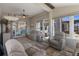 Spacious sunroom with large windows offering ample natural light and comfortable seating at 8534 Sw 59Th Lane Rd, Ocala, FL 34481