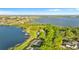 A stunning view of lakefront properties, featuring well-manicured lawns and private docks, creating an ideal lakeside retreat at 248 Lake Tennessee Dr, Auburndale, FL 33823