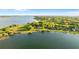 Scenic aerial view of lakefront properties with private docks, showcasing a tranquil and picturesque community at 248 Lake Tennessee Dr, Auburndale, FL 33823