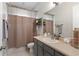 Bathroom with gray vanity and shower with curtain at 248 Lake Tennessee Dr, Auburndale, FL 33823