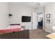 Spacious bedroom featuring a flat-screen TV and modern decor at 248 Lake Tennessee Dr, Auburndale, FL 33823