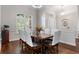 Elegant dining room with hardwood floors, bright windows, and a traditional dining set at 248 Lake Tennessee Dr, Auburndale, FL 33823