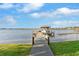 Inviting lake home dock with a charming gazebo provides the perfect spot for relaxation and lakeside enjoyment at 248 Lake Tennessee Dr, Auburndale, FL 33823