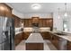 Spacious kitchen boasts ample counter space, stainless appliances, and abundant wood cabinetry at 248 Lake Tennessee Dr, Auburndale, FL 33823