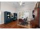 Home office featuring hardwood floors, custom cabinets, bright windows, and a classic desk at 248 Lake Tennessee Dr, Auburndale, FL 33823