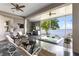 Relaxing patio with a hot tub, lounge chairs, and waterfront view at 248 Lake Tennessee Dr, Auburndale, FL 33823