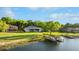Beautiful waterfront home featuring a screened porch, lush lawn, and a private dock, perfect for lakeside living at 248 Lake Tennessee Dr, Auburndale, FL 33823
