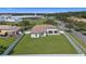 Aerial view showcasing a large backyard with a well-maintained lawn and a white fence at 3601 Weatherfield Dr, Kissimmee, FL 34746
