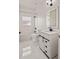 All-white bathroom with shower-tub combo, modern sink and vanity, and black hardware at 3601 Weatherfield Dr, Kissimmee, FL 34746