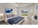 Sunlit main bedroom featuring a bed, slider door, and a neutral color scheme at 3601 Weatherfield Dr, Kissimmee, FL 34746
