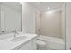 Bright bathroom showcasing vanity with modern faucet and tiled bathtub at 5244 Luisa Ct, St Cloud, FL 34771