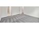 Carpeted bedroom with ensuite bathroom and doorways to additional rooms at 5244 Luisa Ct, St Cloud, FL 34771