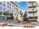 Eye-catching polygonal dog sculpture in a plaza with a modern building backdrop and landscaping at 5244 Luisa Ct, St Cloud, FL 34771