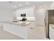 Spacious kitchen featuring white cabinets, stainless steel appliances, and granite countertops at 5244 Luisa Ct, St Cloud, FL 34771
