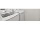 Convenient laundry room featuring modern, energy-efficient washer and dryer at 5244 Luisa Ct, St Cloud, FL 34771