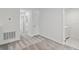 Loft featuring gray carpet, white walls and trim, leading to other rooms at 5244 Luisa Ct, St Cloud, FL 34771