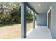 Covered patio area offering a relaxing outdoor space with views of the backyard at 5244 Luisa Ct, St Cloud, FL 34771