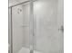 Modern bathroom with a sleek glass-enclosed shower, clean lines, and neutral tiling at 5244 Luisa Ct, St Cloud, FL 34771