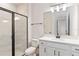 Bathroom showcases a glass enclosed shower, a modern vanity with a dark faucet at 9432 Emerald Berry Dr, Winter Garden, FL 34787