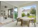 Outdoor patio with a dining table set and a view of the backyard at 9432 Emerald Berry Dr, Winter Garden, FL 34787