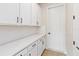 A well-organized pantry features ample storage with white cabinets and countertop space at 9432 Emerald Berry Dr, Winter Garden, FL 34787