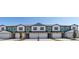 Charming townhome showcasing a two-story facade with a one-car garage, complemented by a well-maintained front yard at 1092 Desert Candle Dr, Ocoee, FL 34761