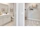Bathroom and closet, featuring white cabinets, and ample shelving at 1104 Desert Candle Dr, Ocoee, FL 34761